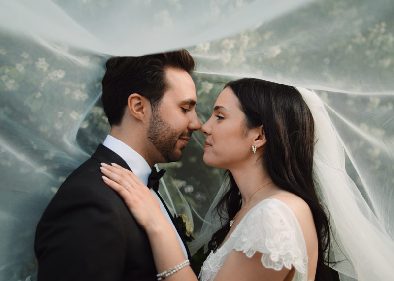 Couple kisses at their Four Seasons Hotel wedding in Toronto