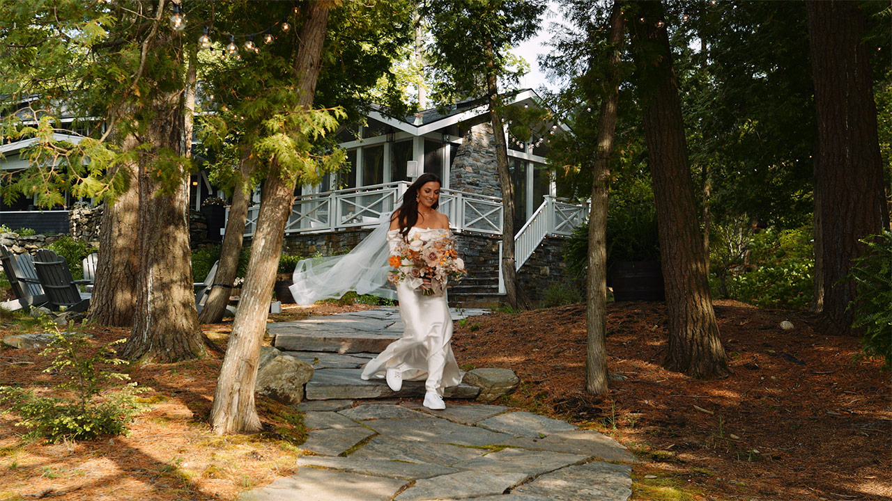 Madi walks down the aisle of her Muskoka wedding ceremony