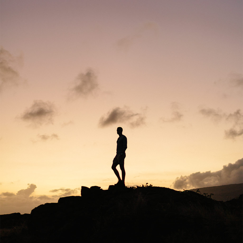 Ric silhouetted against a Hawaiian sunset